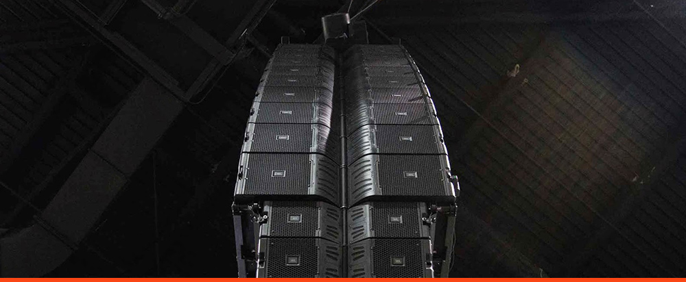 Speaker array suspended from stage scaffolding